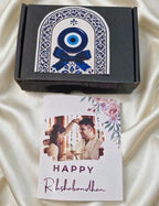 Personalized Evil Eye Rakhi Gift Hamper for Brother | Custom Name Rakhi with Greeting Card, Chocolate & Premium Gift Box